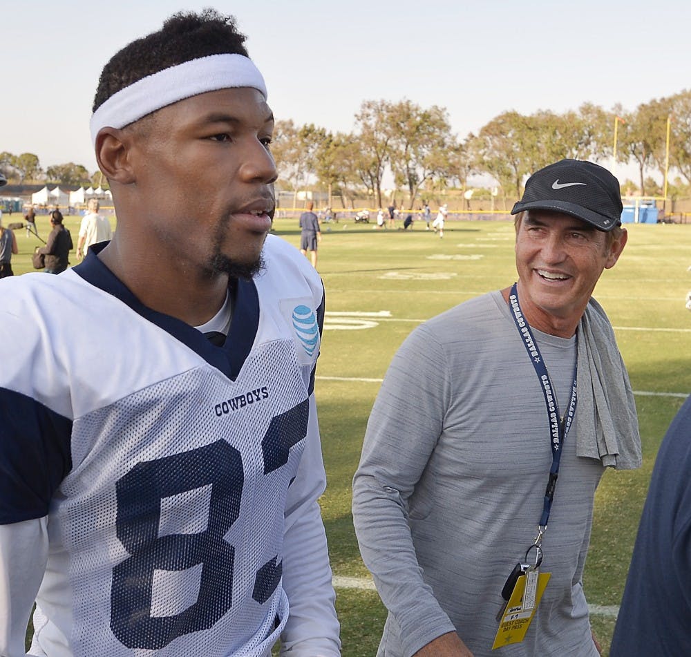Former Baylor football coach Art Briles, right, walks off the field with Dallas Cowboys wide receiver Terrance Williams (83) after the Cowboys' afternoon practice during training camp in Oxnard, Calif., on Tuesday, Aug. 9, 2016. (Max Faulkner/Fort Worth Star-Telegram/TNS)