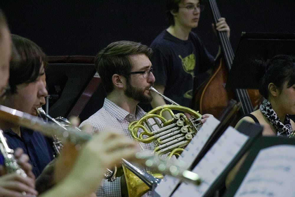 <p>A University of South Carolina student plays the French horn during a wind ensemble rehearsal on March 21, 2024. The 鶹С򽴫ý Wind Ensemble is open to students of all majors by audition.</p>
