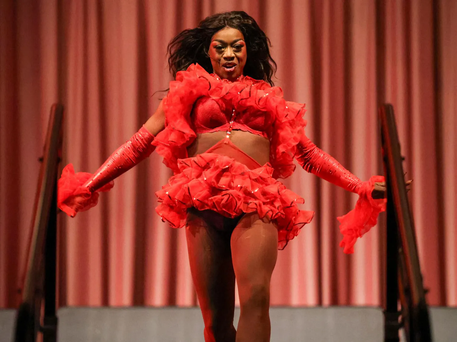 Drag queen Susu Serenity struts down the stage after an outfit change in the Russell House Ballroom on April 14, 2026. Birdcage is one of the last of IRIS’s LGBTQ+ events each spring semester.