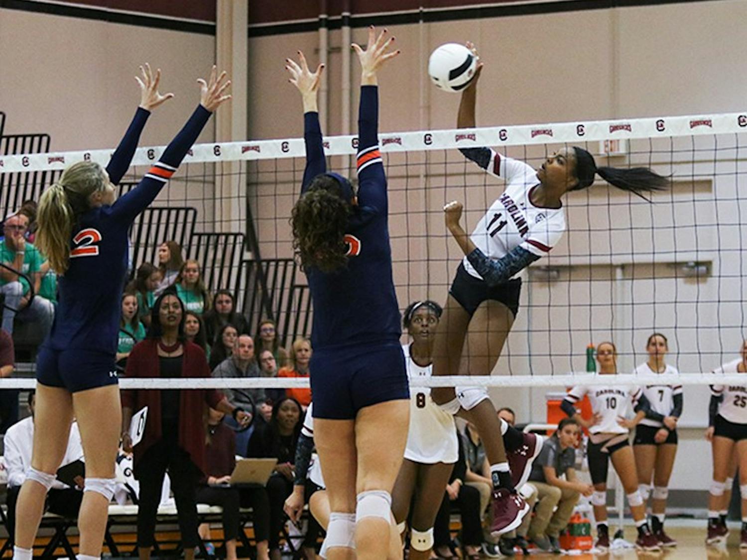 &nbsp;Senior middle blocker Mikayla Robinson spikes the ball while two of Auburn’s players go to block. During her four years at USC, Robinson ended with a career total of 983 kills and 81 blocks.&nbsp;