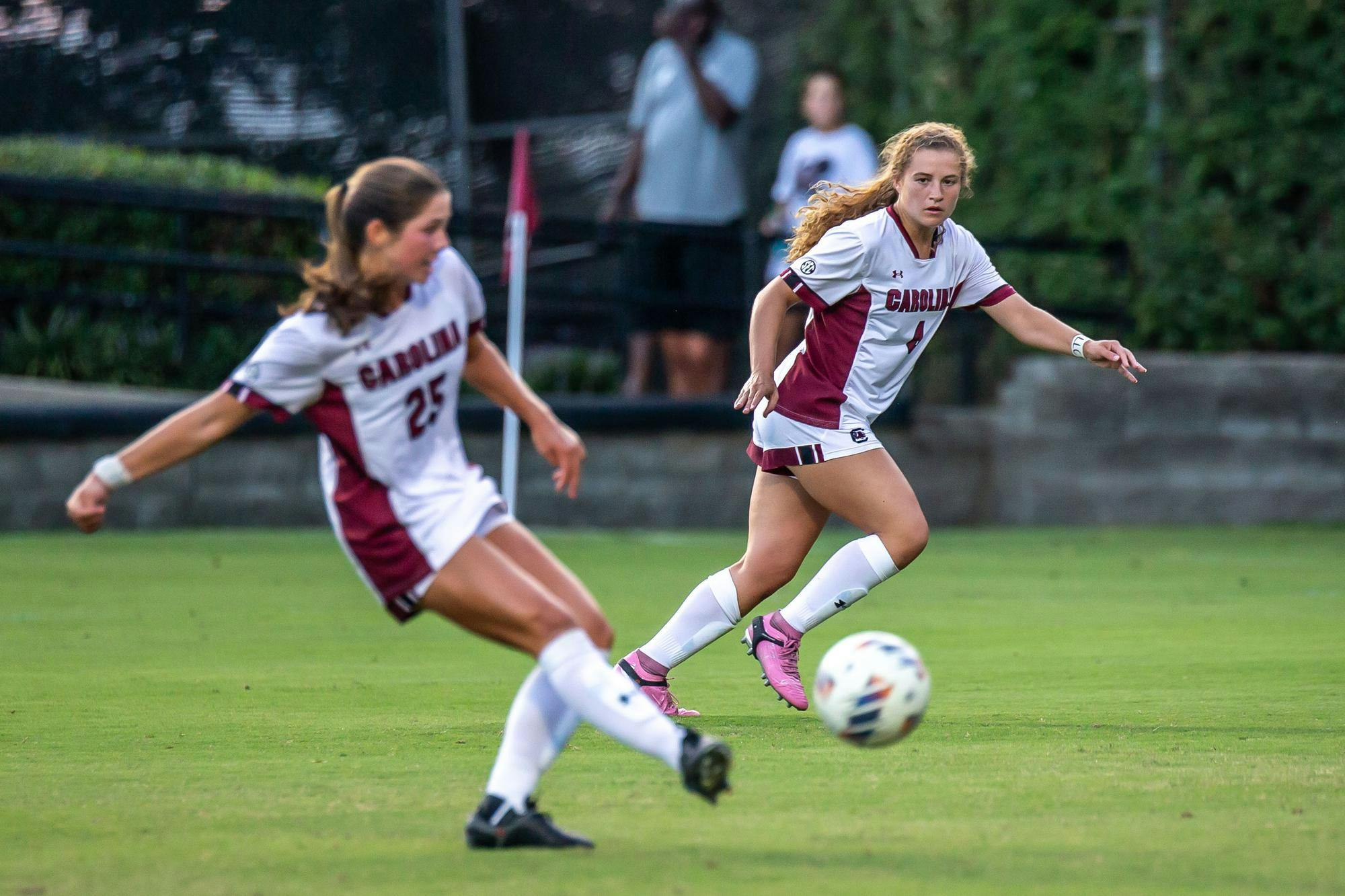 Freshman forward Katie Shea Collins watches her teammate, senior midfielder Lily Render, advance the ball during South Carolina's match against Furman on August 18, 2024, at Stone Stadium. Collins recorded a hat trick in the first 30 minutes of play in the Gamecocks' 5-1 victory over the Paladins.