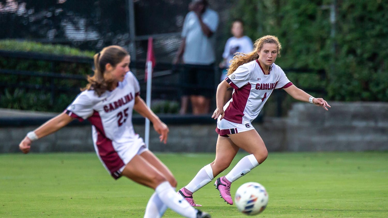 Freshman forward Katie Shea Collins watches her teammate, senior midfielder Lily Render, advance the ball during South Carolina's match against Furman on August 18, 2024, at Stone Stadium. Collins recorded a hat trick in the first 30 minutes of play in the Gamecocks' 5-1 victory over the Paladins.