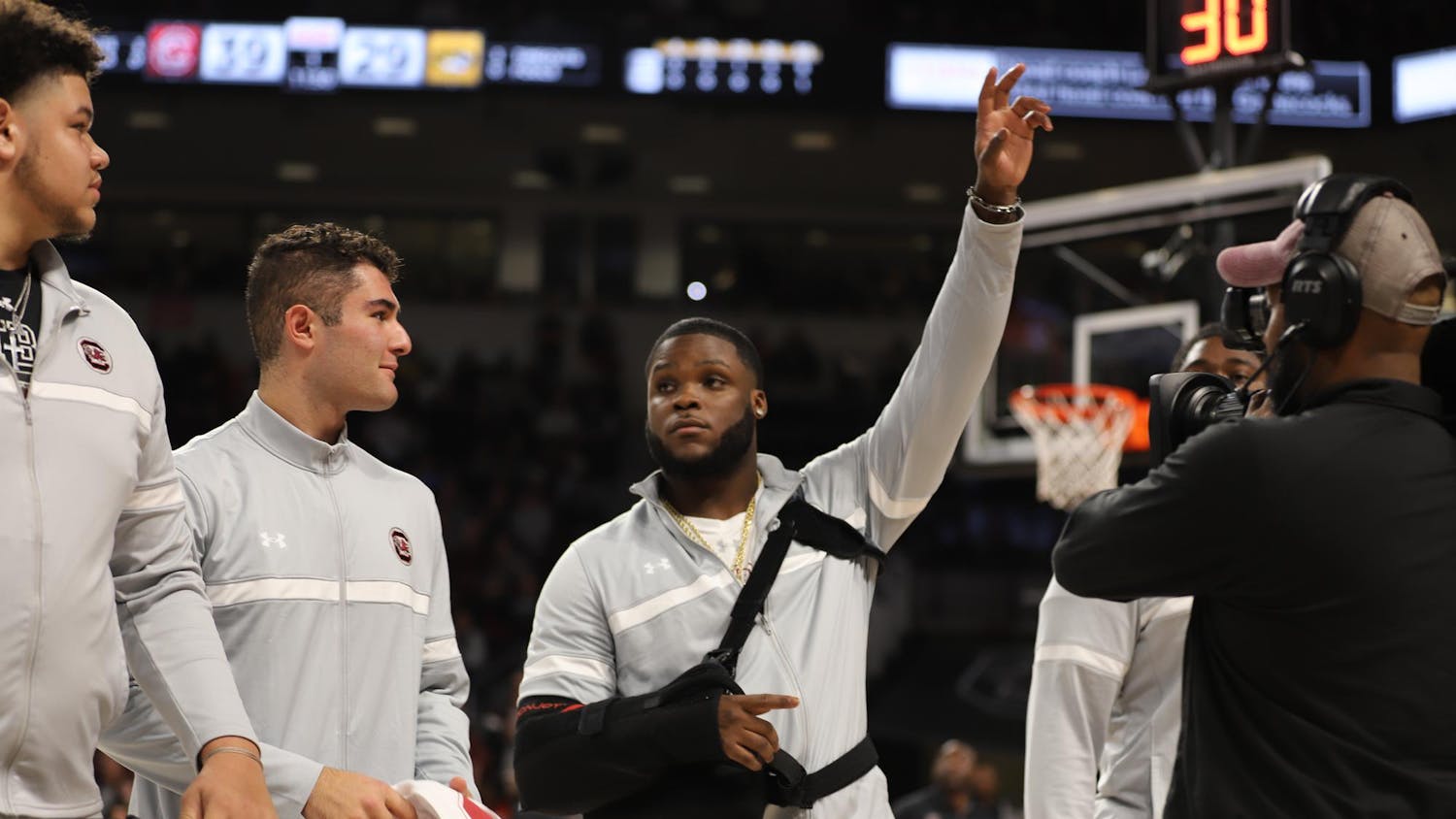 Incoming senior running back Raheim "Rocket" Sanders waves to the crowd during a recognition ceremony for new Gamecock football players before the South Carolina's men's basketball game against Missouri at Colonial Life Arena on Jan. 27, 2024. Sanders will spend his remaining year of eligibility with the Gamecocks after transferring from Arkansas, where he rushed for 2,230 yards with 17 touchdowns over three seasons.