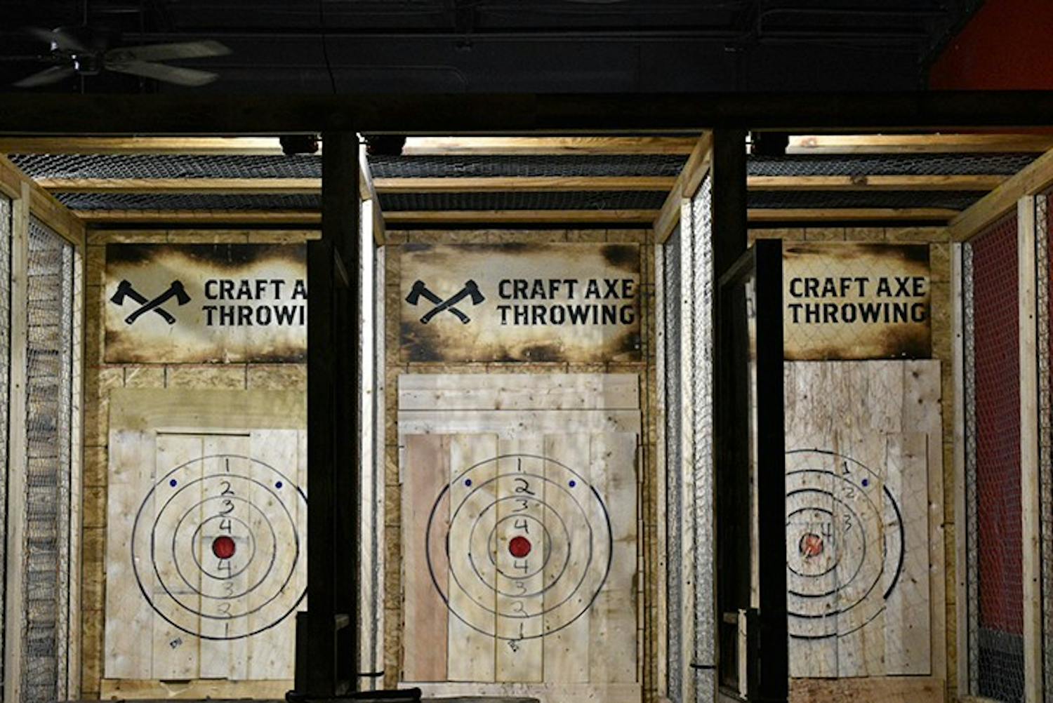 Craft Axe Throwing has divided lanes with bullseye's for customers to throw at.