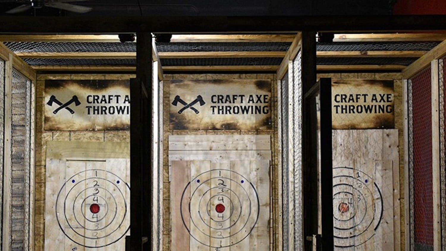 Craft Axe Throwing has divided lanes with bullseye's for customers to throw at.