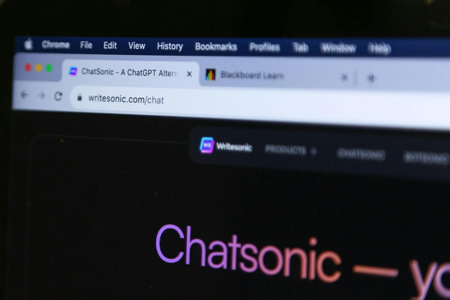 A photo illustration of a computer screen showing tabs open for Chatsonic and Blackboard Learn on Oct. 4, 2023. Chatsonic is an AI-powered chatbot developed to rival ChatGPT.