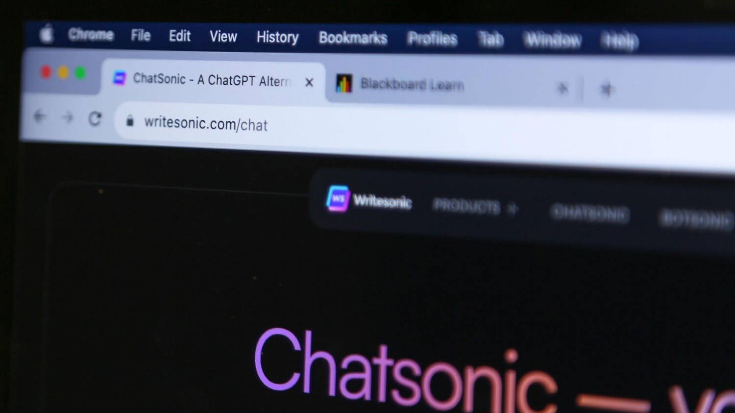 A photo illustration of a computer screen showing tabs open for Chatsonic and Blackboard Learn on Oct. 4, 2023. Chatsonic is an AI-powered chatbot developed to rival ChatGPT.