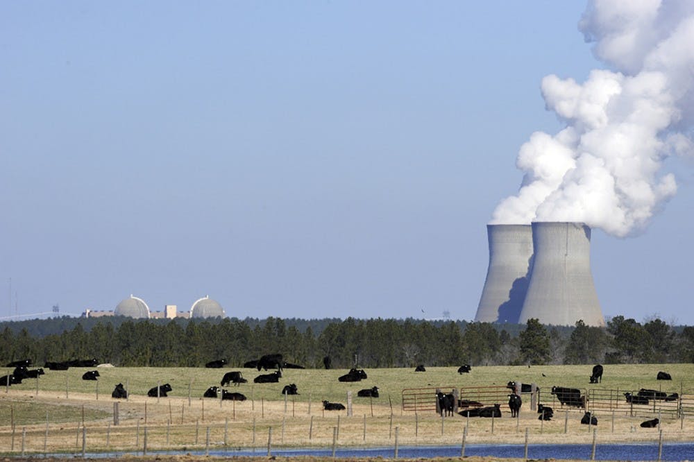 Cattle graze near the cooling towers for Georgia Power&apos;s Vogtle nuclear power plant in Waynesboro, Ga. The plant uses the Westinghouse AP1000 advanced pressurized water reactor technology. (Erik Lesser/Zuma Press/TNS) 