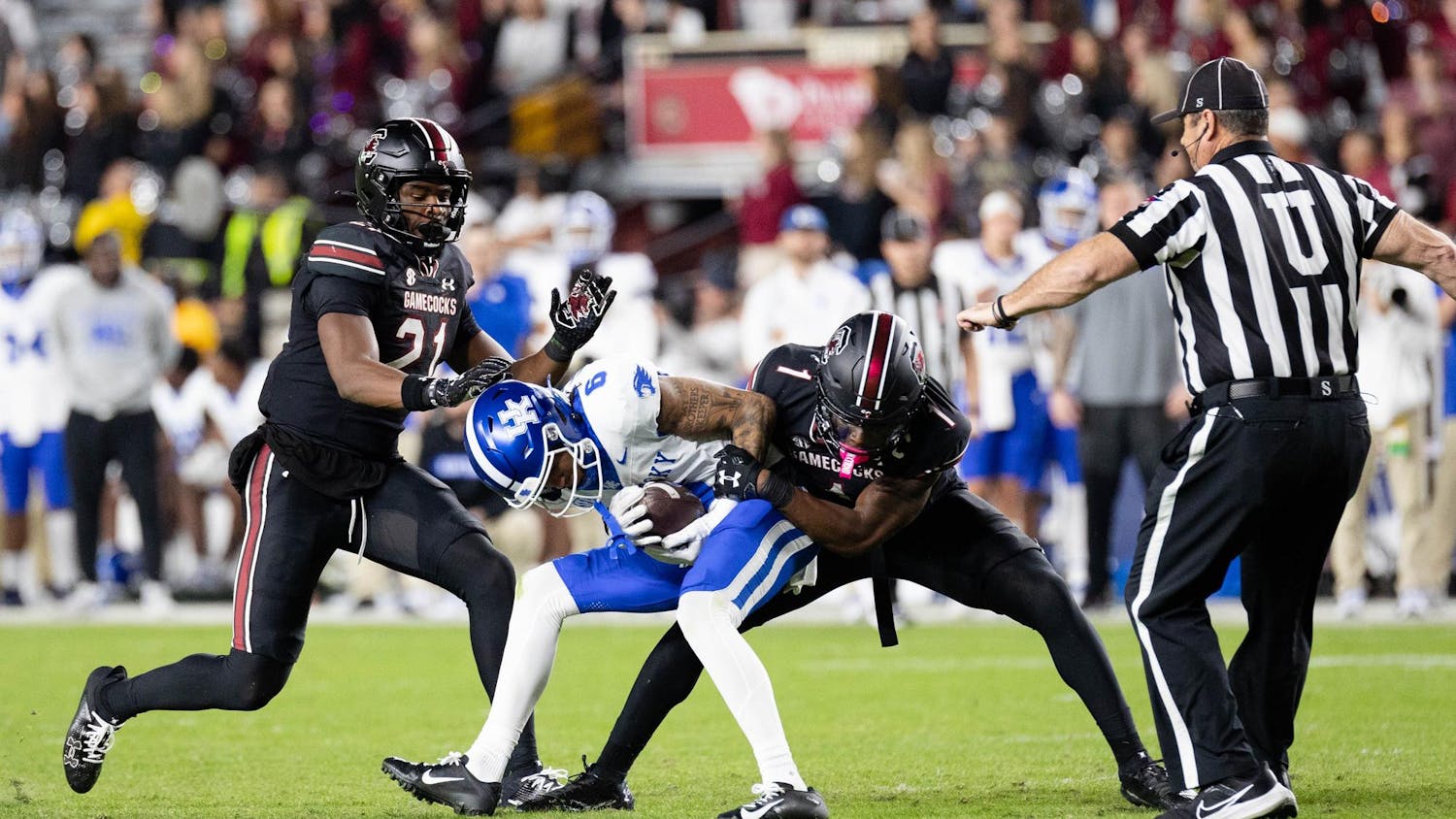 FILE — Then sophomore defensive back D.Q. Smith tackles then Kentucky sophomore tight end Izayah Cummings during South Carolina's game against Kentucky on Nov. 18, 2023, at Williams-Brice Stadium. The Gamecocks will take on the Wildcats in the team's first away game of the season on Sept. 7, 2024 at Kroger Field in Lexington, Kentucky.