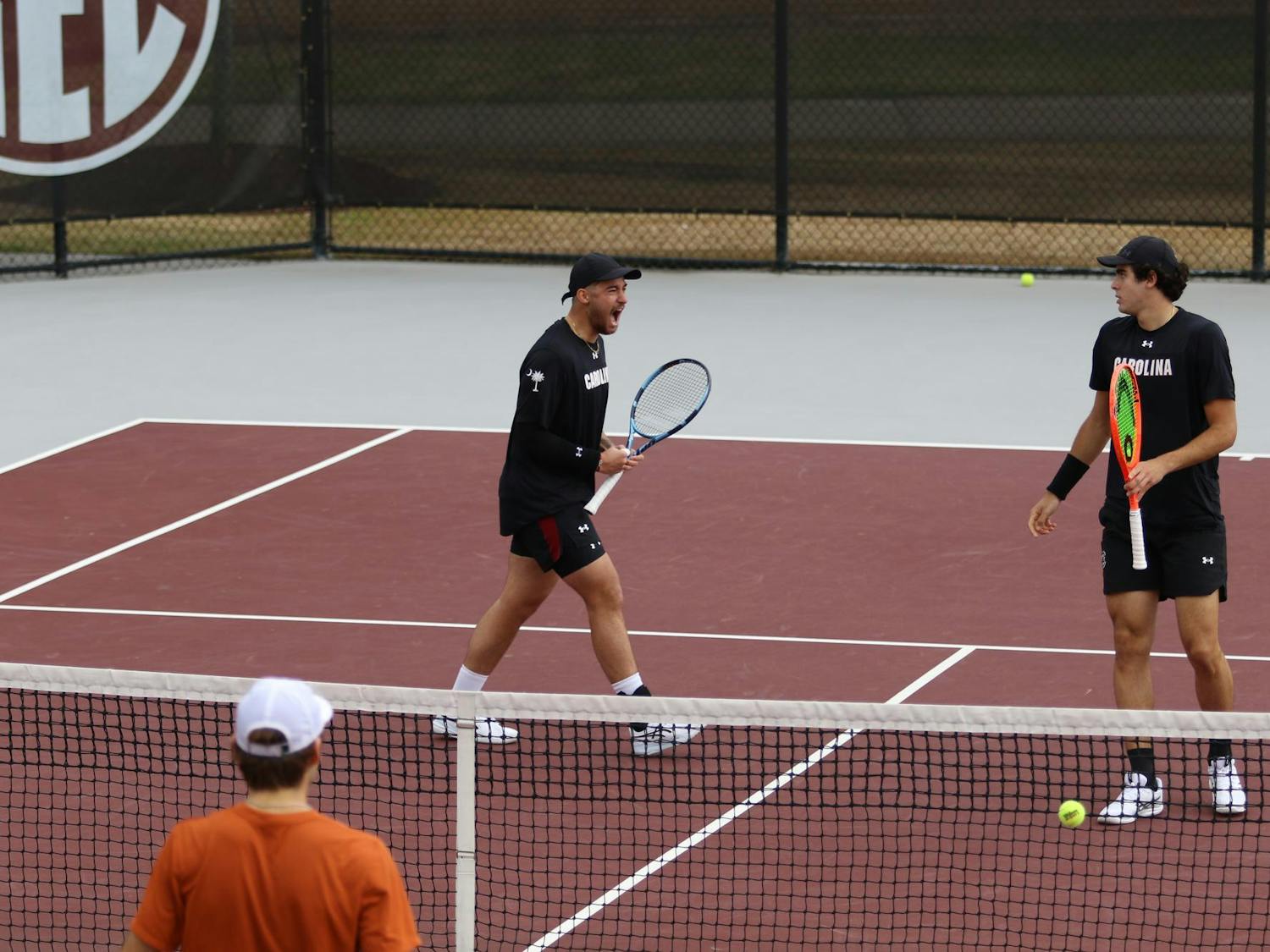 Redshirt freshman Paul Barbier Gazeu celebrates after he and senior Lucas Andrade da Silva won a point in doubles against the University of Texas on Feb. 27, 2026. The pair won their match against the Longhorns 6-4.