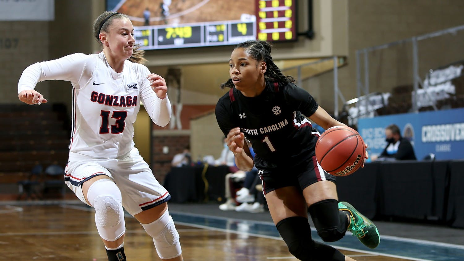 Sophomore guard Zia Cooke dribbles the ball around a Gonzaga defender. The Gamecocks won the game 79-72.