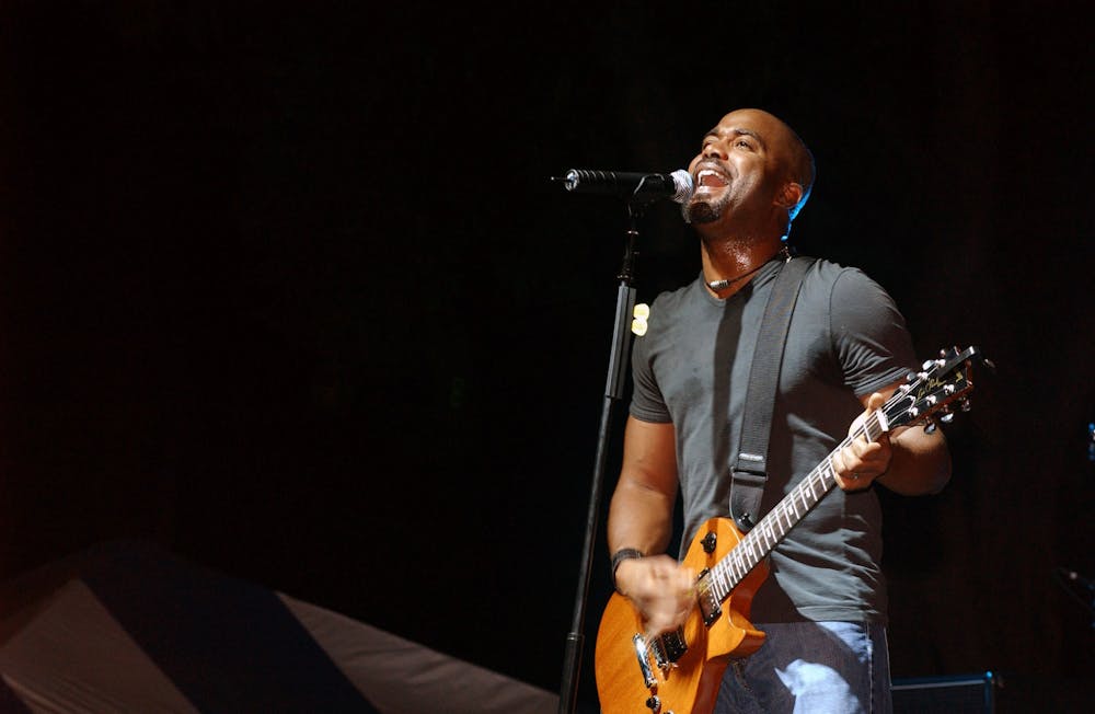 An image of Darius Rucker singing the National Anthem is projected