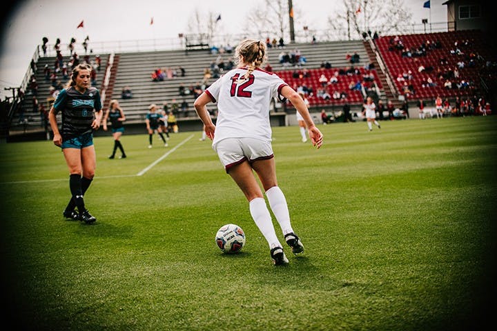 Junior defender Sutton Jones looks to dribble past a Coastal Carolina defender. The Gamecocks beat the Chanticleers 3-0 to remain undefeated at home this season.