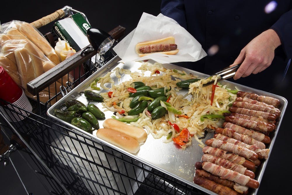 Times Test Kitchen chef Noelle Carter built a cart that can cook bacon-wrapped hot dogs and dispense beer on tap. (Kirk McKoy/Los ANgeles Times/TNS) 