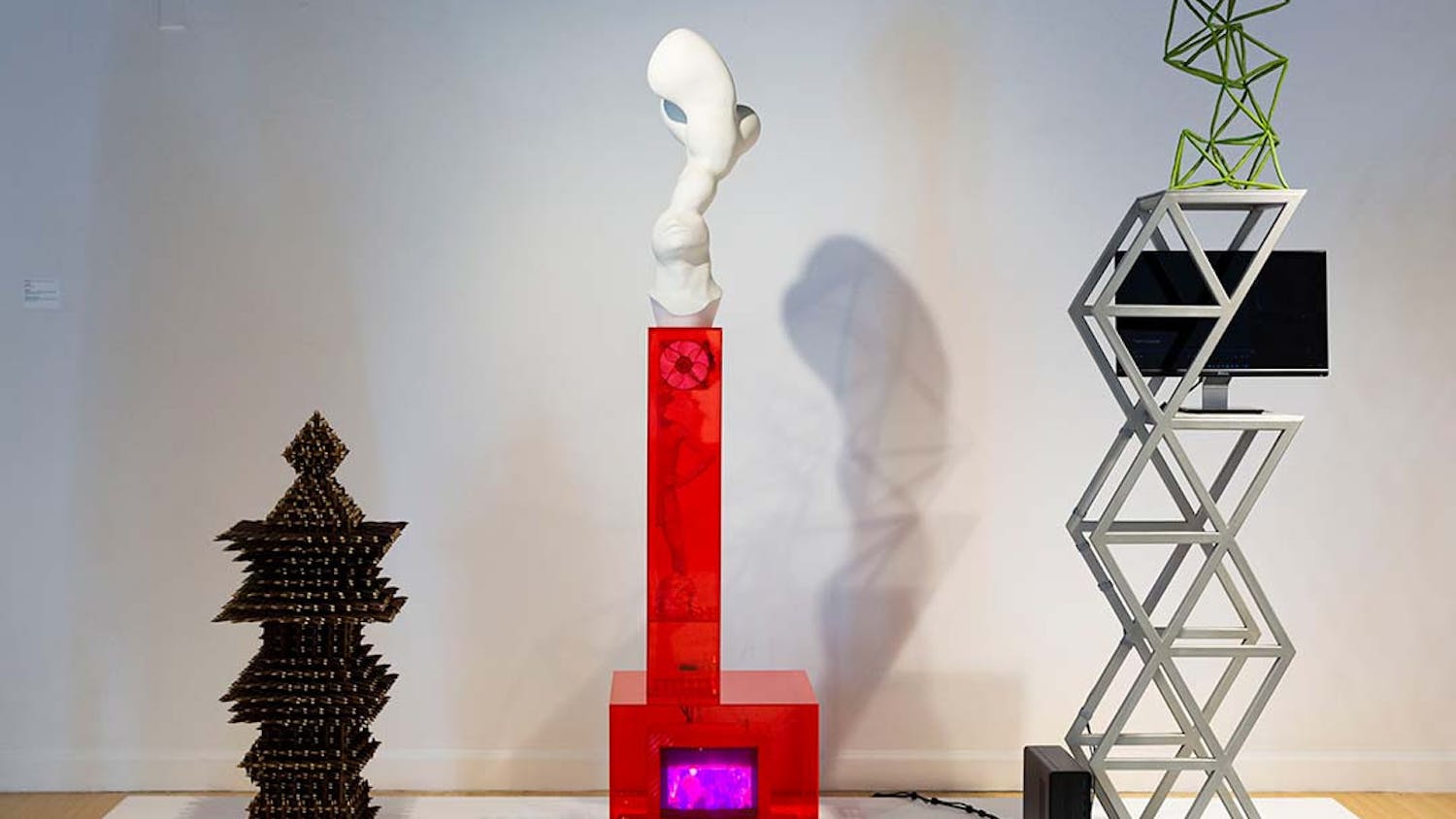 "The Thorn" (left), "The Side" (center) and "The Pleasure Principle" (right) by Eli Kessler. All three pieces comment on the underlying psychology of American folk art, 1980s pop culture and contemporary society.