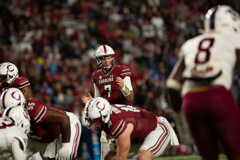 <p>FILE— Redshirt junior quarterback Spencer Rattler stays calm and collected before the snap. Rattler successfully conducted passes and rushing plays to secure the victory for the Gamecocks against South Carolina State on Sept. 29, 2022.</p>