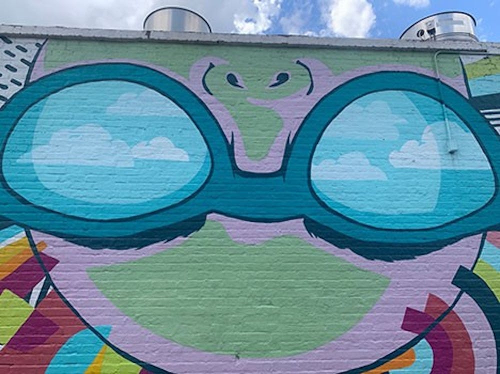 <p>"Lady Vista" on a brick wall painted by freelance artist Cait Maloney located on the wall of Boku Kitchen and Saloon in Columbia, SC.</p>