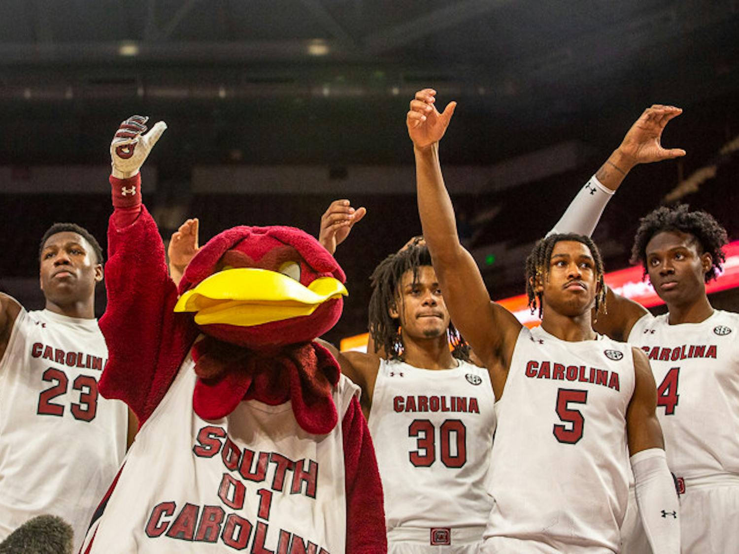 The men’s basketball team and Cocky offer a toast during the playing of South Carolina's alma mater after the Gamecocks victory over S.C. State. The Gamecocks defeated the Bulldogs 80-77 on Nov. 8, 2022.