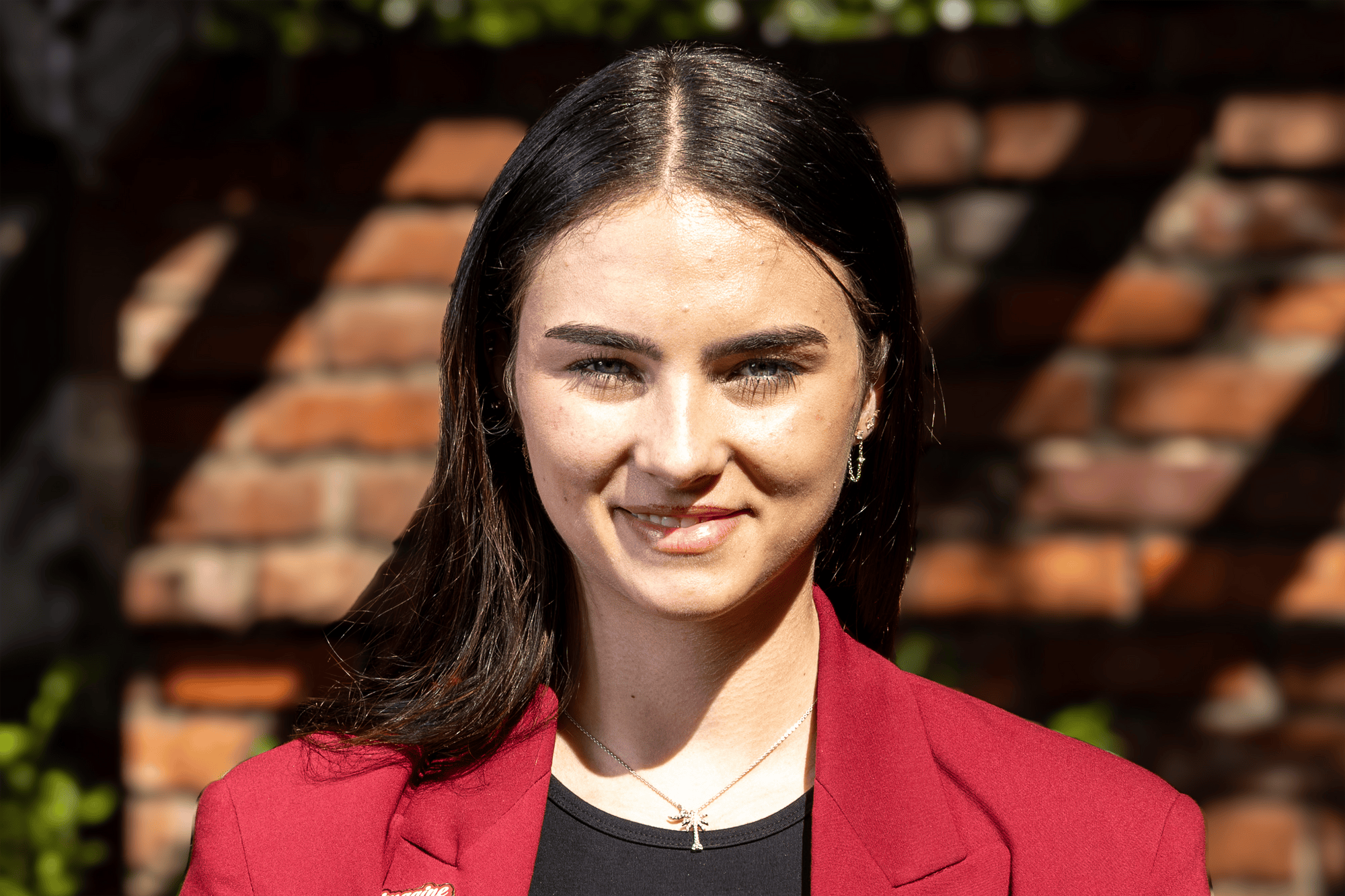 Ashley Reynolds, a third-year risk management, insurance and finance student, poses for a portrait outside the Kennedy Greenhouse Studio on Feb. 17, 2026. Reynolds will serve as the student body treasurer for the 2026-27 school year.