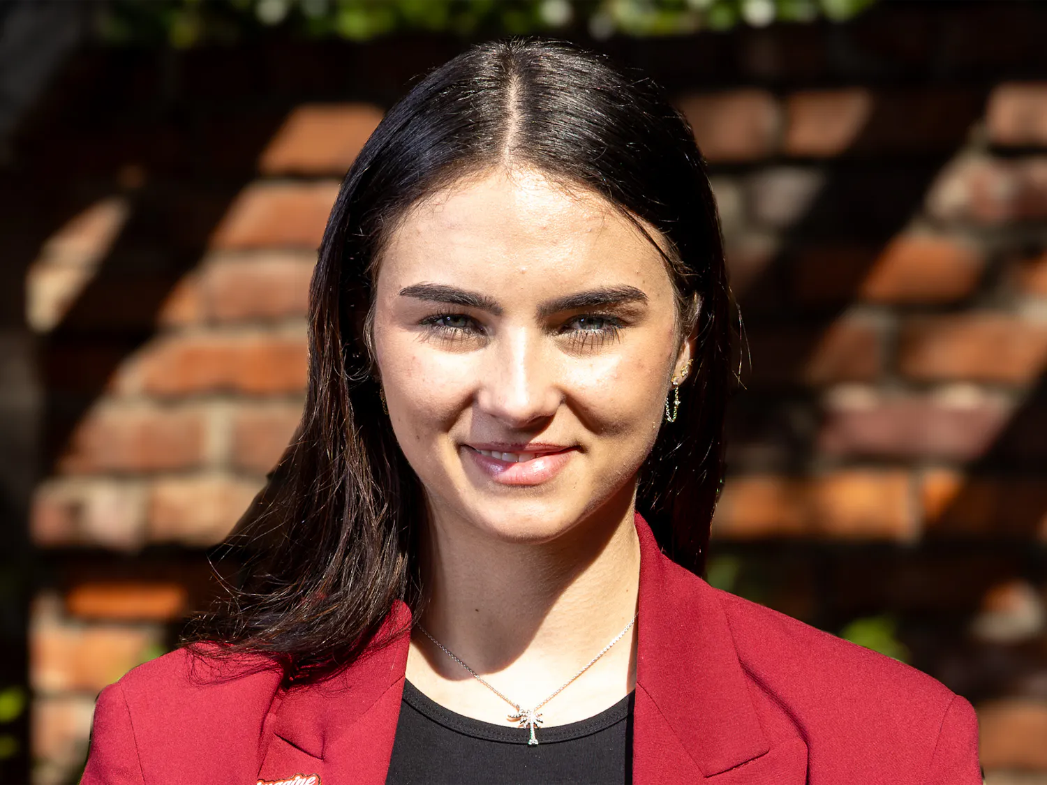 Ashley Reynolds, a third-year risk management, insurance and finance student, poses for a portrait outside the Kennedy Greenhouse Studio on Feb. 17, 2026. Reynolds will serve as the student body treasurer for the 2026-27 school year.