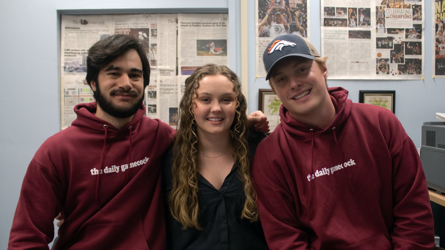 The Daily Gamecock's managing staff poses for a photo in the newsroom on Nov. 20, 2022. Editor-in-Chief Kailey Cota and managing editors Tyler Fedor (left) and Michael Sauls (right) have each worked with The Daily Gamecock for seven semesters and will step down on Dec. 12, 2022.