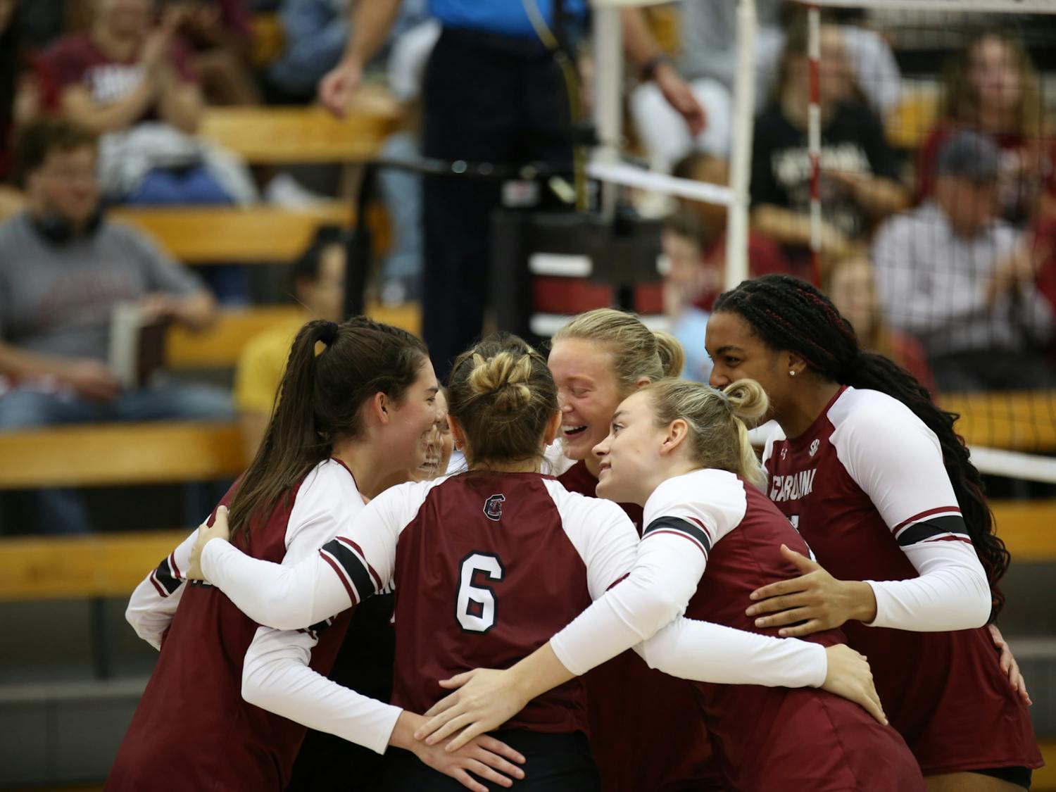The Gamecocks huddling up in celebration of a point against the Tigers in their second matchup of their weekend series on Oct. 2, 2022. After a comeback first game, South Carolina closed its second game with a straight-set win.&nbsp;