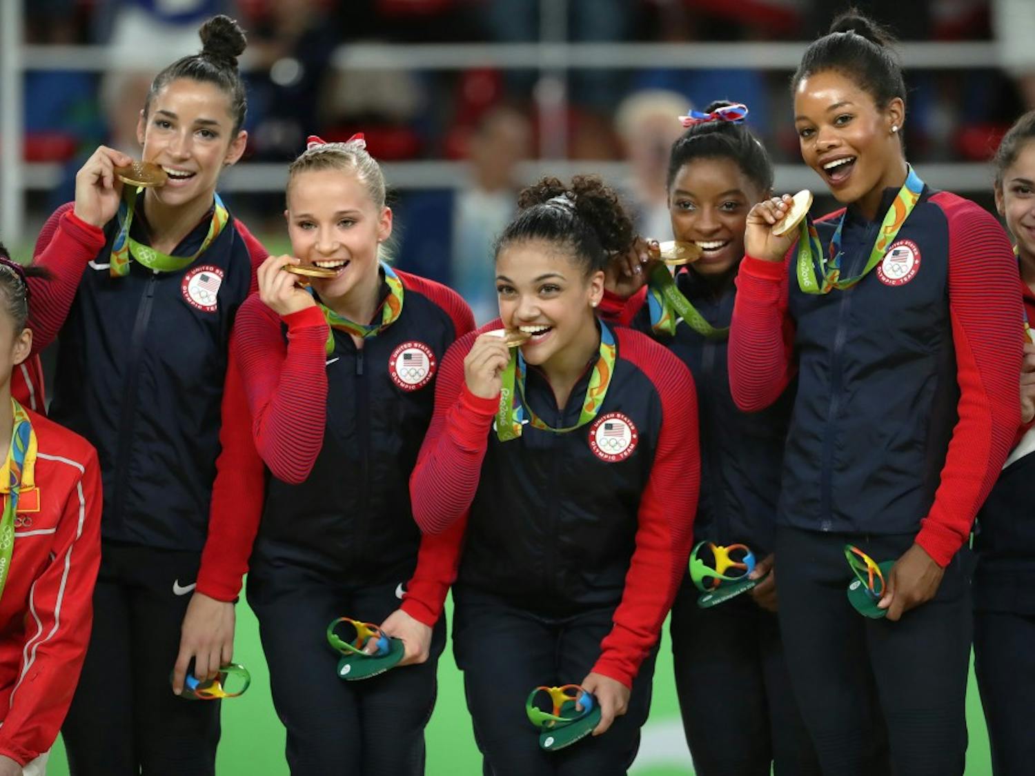 From left, Alexandra Raisman, Madison Kocian, Lauren Hernandez, Simone Biles and Gabby Douglas celebrate on the medal stand on August 9, 2016, at the Rio Olympic Games in Rio De Janeiro, Brazil. The U.S. women's squad captured the gold medal in the team competition. (Brian Peterson/Minneapolis Star Tribune/TNS)