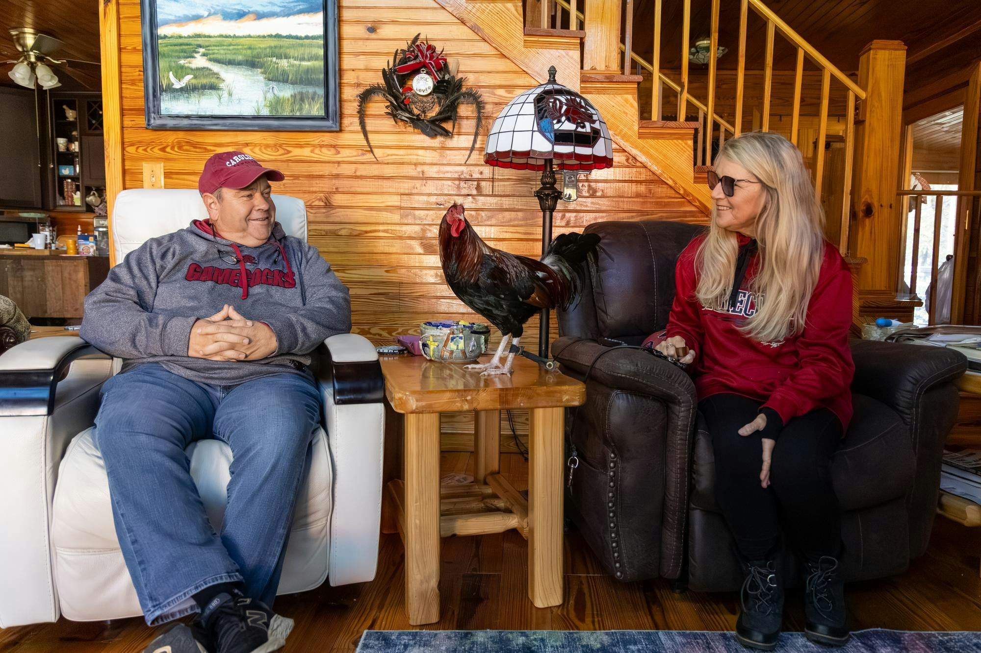 Edgefield residents Van and Beth Clark sit in their living room with the USC live mascot Sir Big Spur at their farm on Nov. 12, 2025. The Clarks are both retired teachers and are the primary caretakers of Sir Big Spur, who makes regular appearances at athletic events.