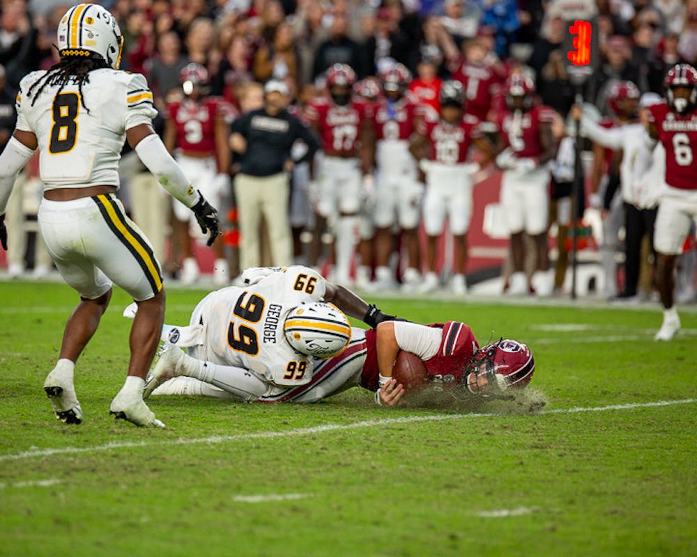 <p>Redshirt junior quarterback Spencer Rattler gets tackled after attempting to scramble the ball down the field during the South Carolina vs. Missouri game on Oct. 29, 2022. . The Tigers beat the Gamecocks 23-10.</p>