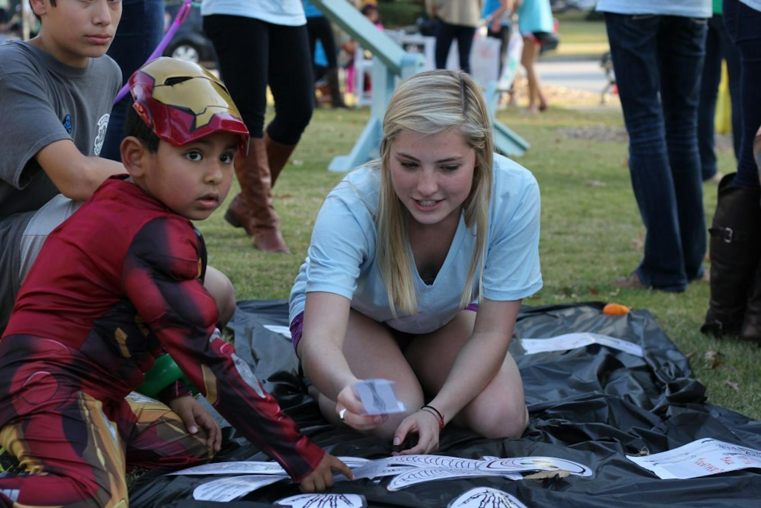 	Children of USC faculty and staff as well as the surrounding neighborhood participating in Trick-or-Treat with the Greeks, an annual event where students from Greek organization give out candy and play games with the children.