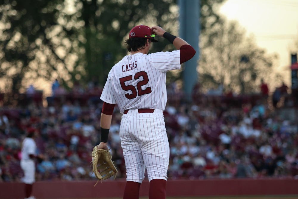 <p>Senior infielder Gavin Casas adjusts his hat during the 9-8 Gamecock victory over the Missouri Tigers at Founders Park on March 24, 2023. Casas decided to return to Gamecock baseball for his senior season, foregoing the MLB draft.</p>
