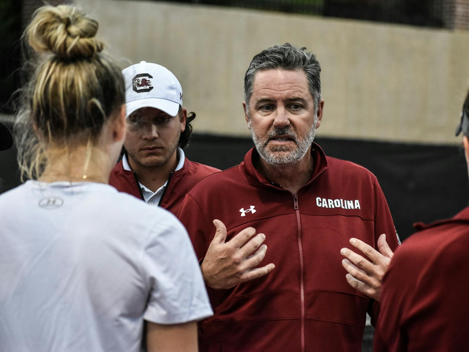 Women's tennis head coach Kevin Epley talks to the team in-between sets during the match against Kentucky on March 17, 2023. The Gamecocks won 4-3, improving to 7-6 on the season.