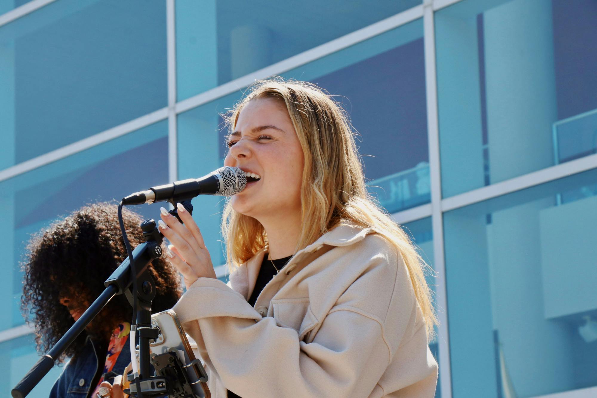 Third-year music industry studies student Julia Clark performs during Women on the Dock. Clark has a love for music and said she wants to spread her voice to others and be a positive change. “It’s been so cool and so special because I feel like sometimes in the music industry, obviously, women get kind of shoved to the side a little bit. So, this is the chance for me and my good friend Hope to come out and show our stuff and kind of get to be the center of attention for the day, which is super nice and super fun," Clark said.
