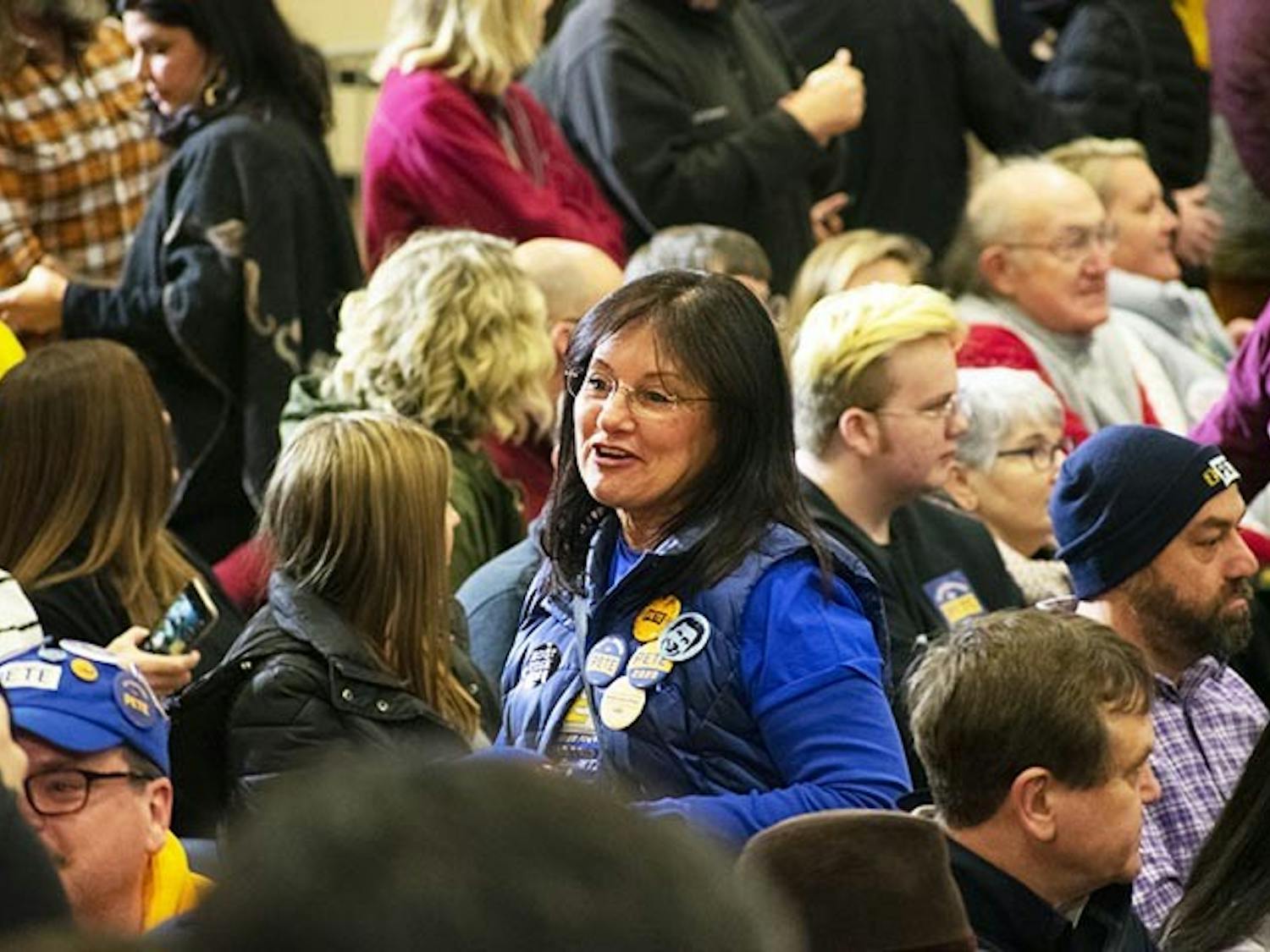 Volunteers and attendees watch Pete Buttigieg speak the Get Out the Vote town hall in Seven Oaks Park on Feb. 29, 2020.