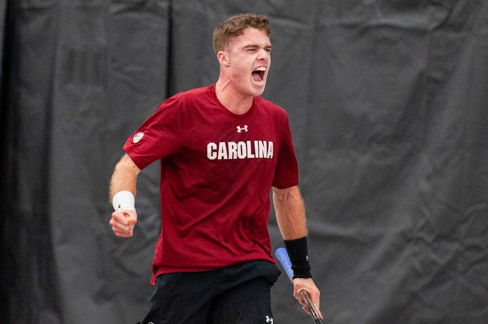 Junior Daniel Rodrigues plays up in his doubles match against Wake Forest. Rodrigues and sophomore Connor Thomson went into the match ranked fifth for D1 doubles. 