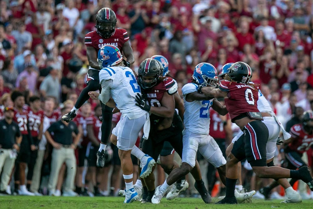 <p>FILE — Junior defensive back DQ Smith jumps to try and block the pass while redshirt junior defensive tackle T.J. Sanders goes for the tackle during South Carolina's game against Ole Miss on Oct. 5, 2024, at Williams-Brice Stadium. The Gamecocks are 3-3 overall following a week six loss to Alabama.</p>