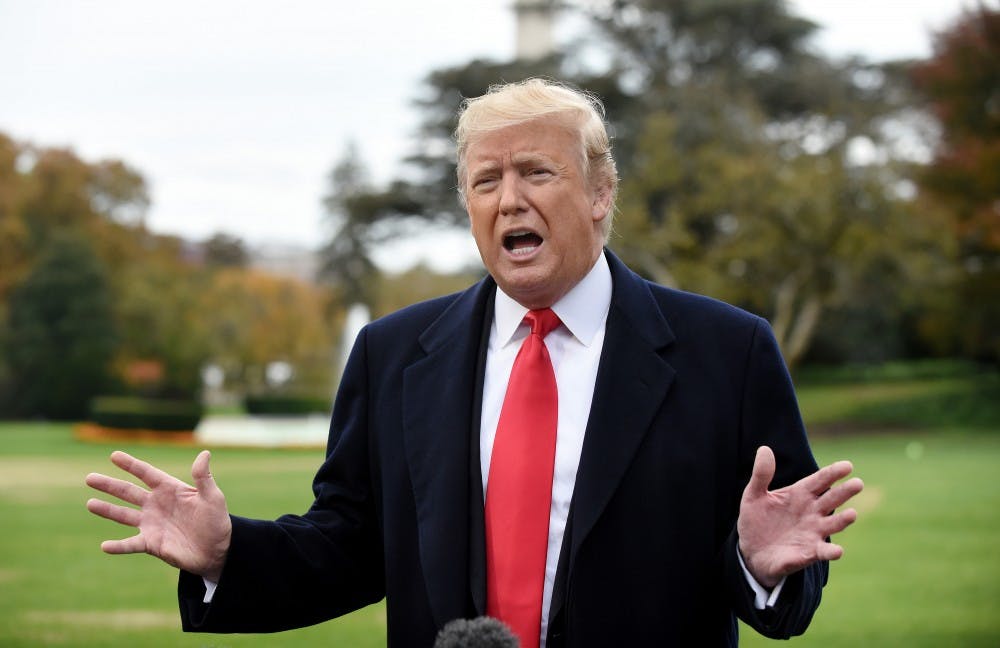 President Donald Trump answers questions from the media on the South Lawn as he departs the White House in Washington, D.C., on Friday, Nov. 2, 2018. (Olivier Douliery/Abaca Press/TNS)