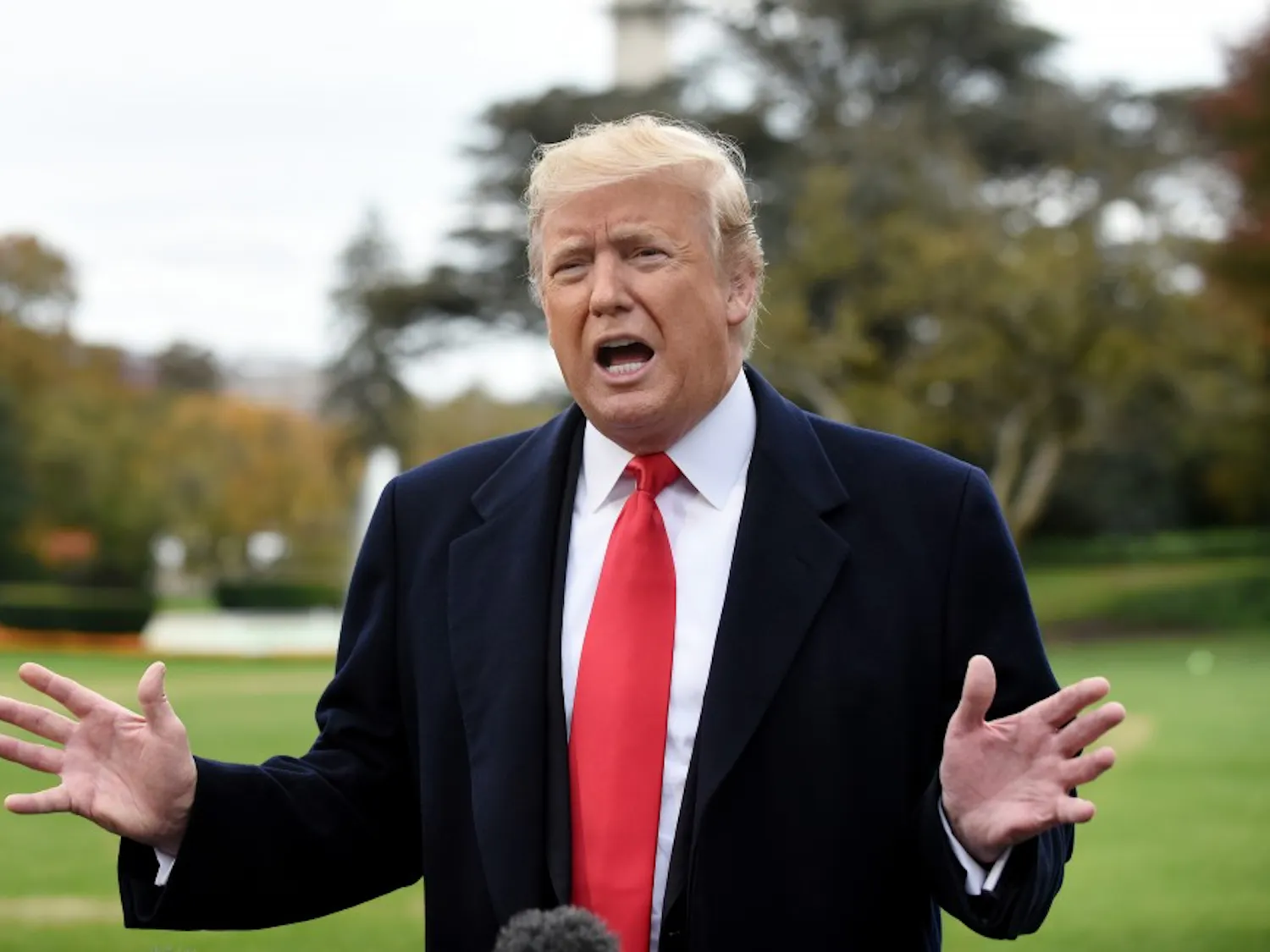 President Donald Trump answers questions from the media on the South Lawn as he departs the White House in Washington, D.C., on Friday, Nov. 2, 2018. (Olivier Douliery/Abaca Press/TNS)