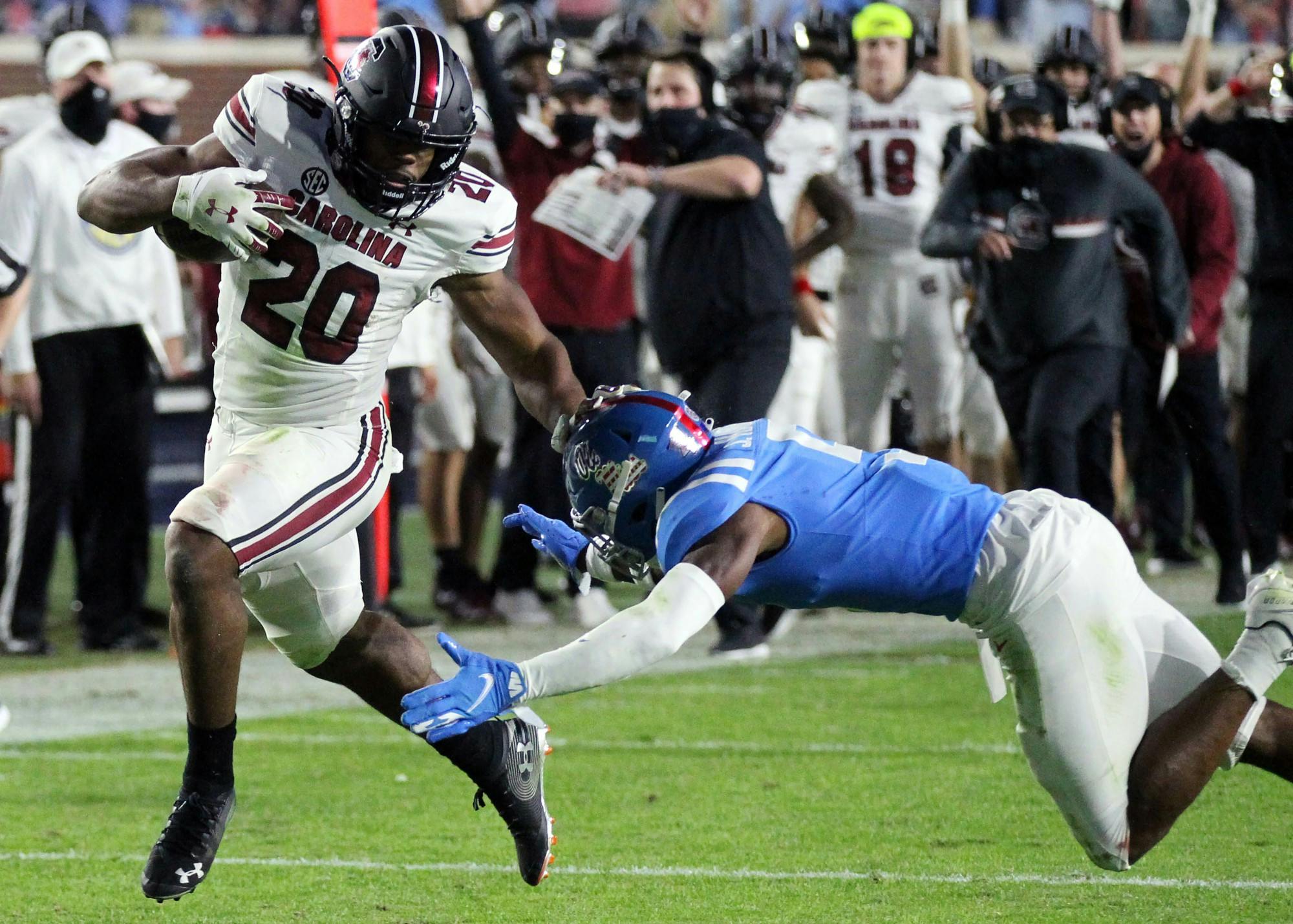 Sophomore running back Kevin Harris avoids being tackled while carrying the ball during the game against the Ole Miss Rebels Saturday. The Gamecocks lost 59-42 and their record fell to 2-5.