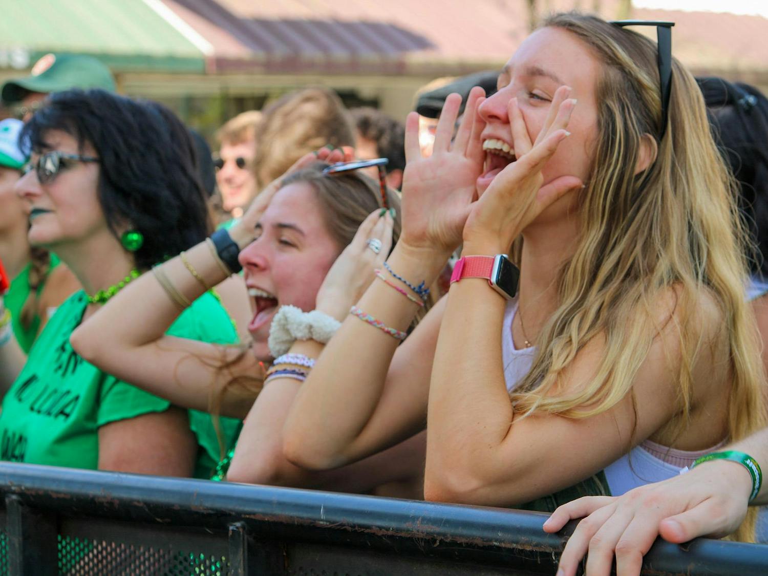 Third-year student Ramsey McIntyre cheers as the band Happy Landing performs during St. Pat's in Five Points in Columbia, South Carolina on March 16, 2024. The band was one of six acts to perform on the Blossom Stage.