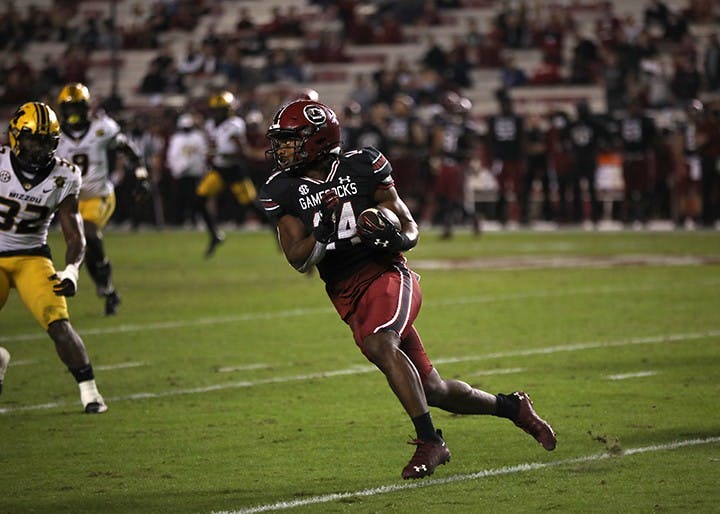 Redshirt sophomore running back Deshaun Fenwick looks downfield as he runs with the ball. The Gamecocks fell to the Missouri Tigers 17-10.
