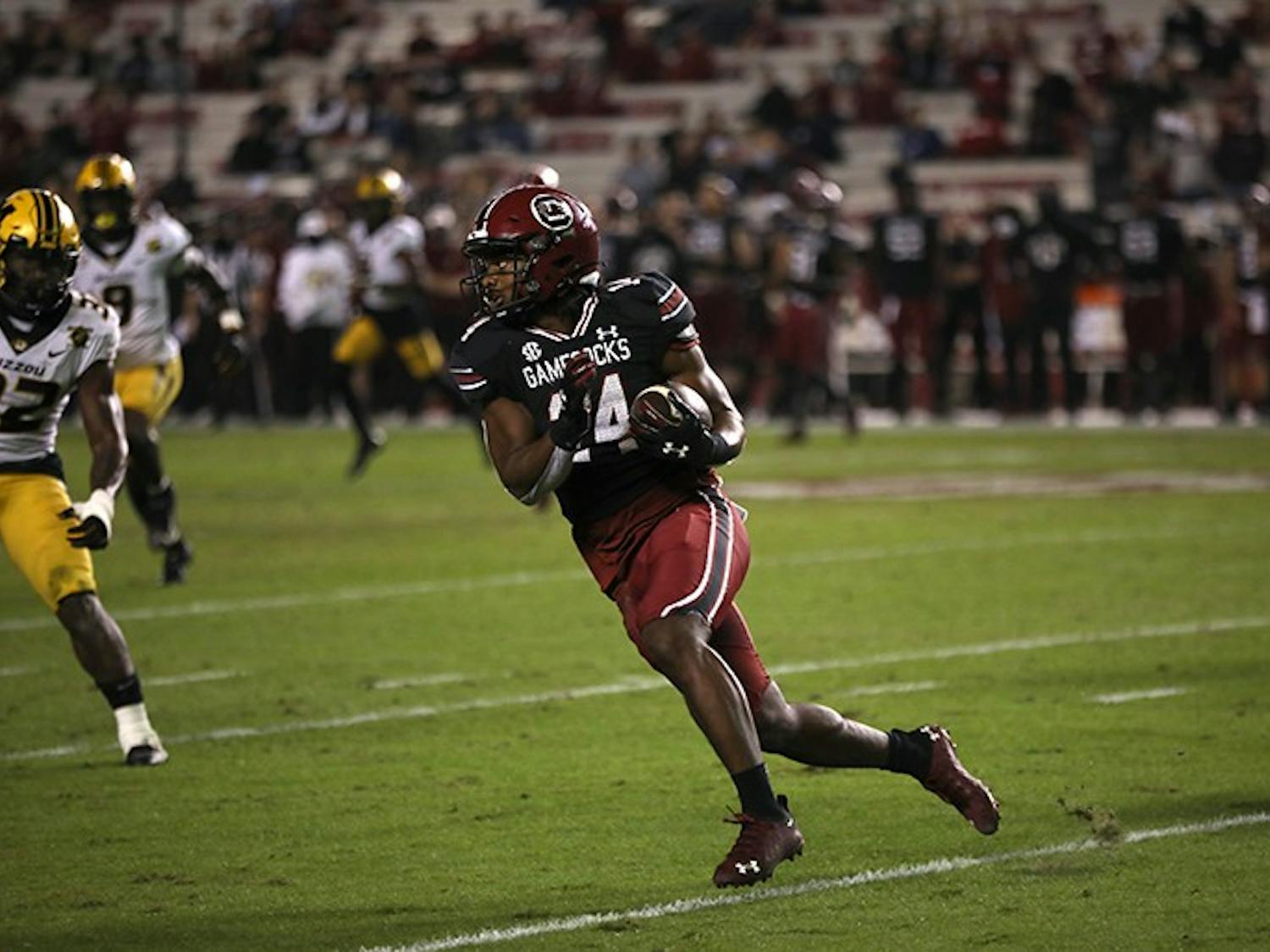 Redshirt sophomore running back Deshaun Fenwick looks downfield as he runs with the ball. The Gamecocks fell to the Missouri Tigers 17-10.