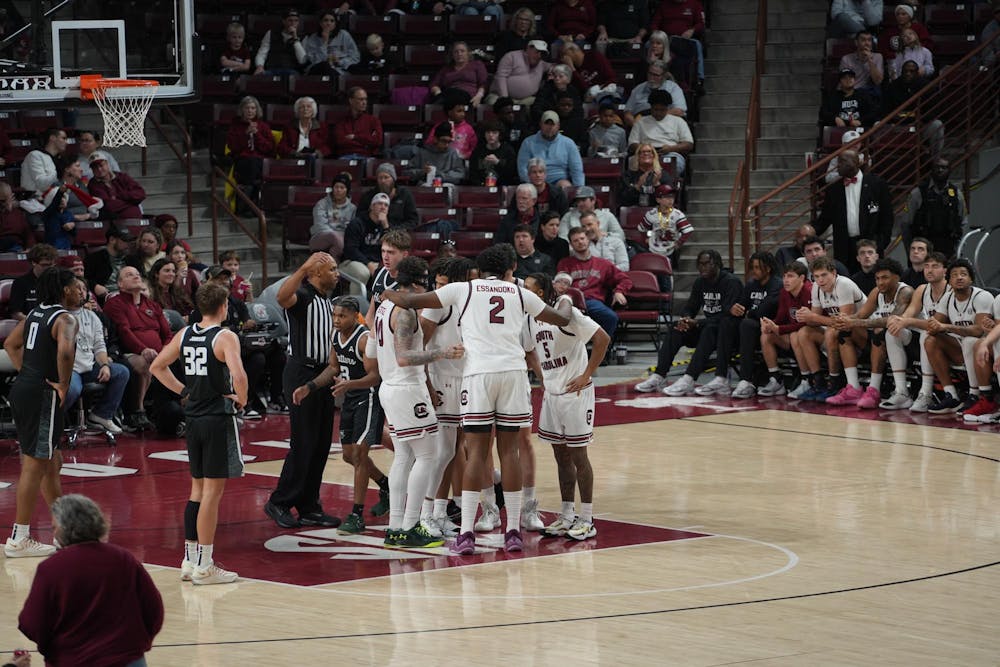 <p>South Carolina huddles up near the free-throw line as players regroup between whistles at Colonial Life Arena. The unified moment reflects the Gamecocks’ control throughout their 82-51 win over Stetson in Columbia, South Carolina.</p>