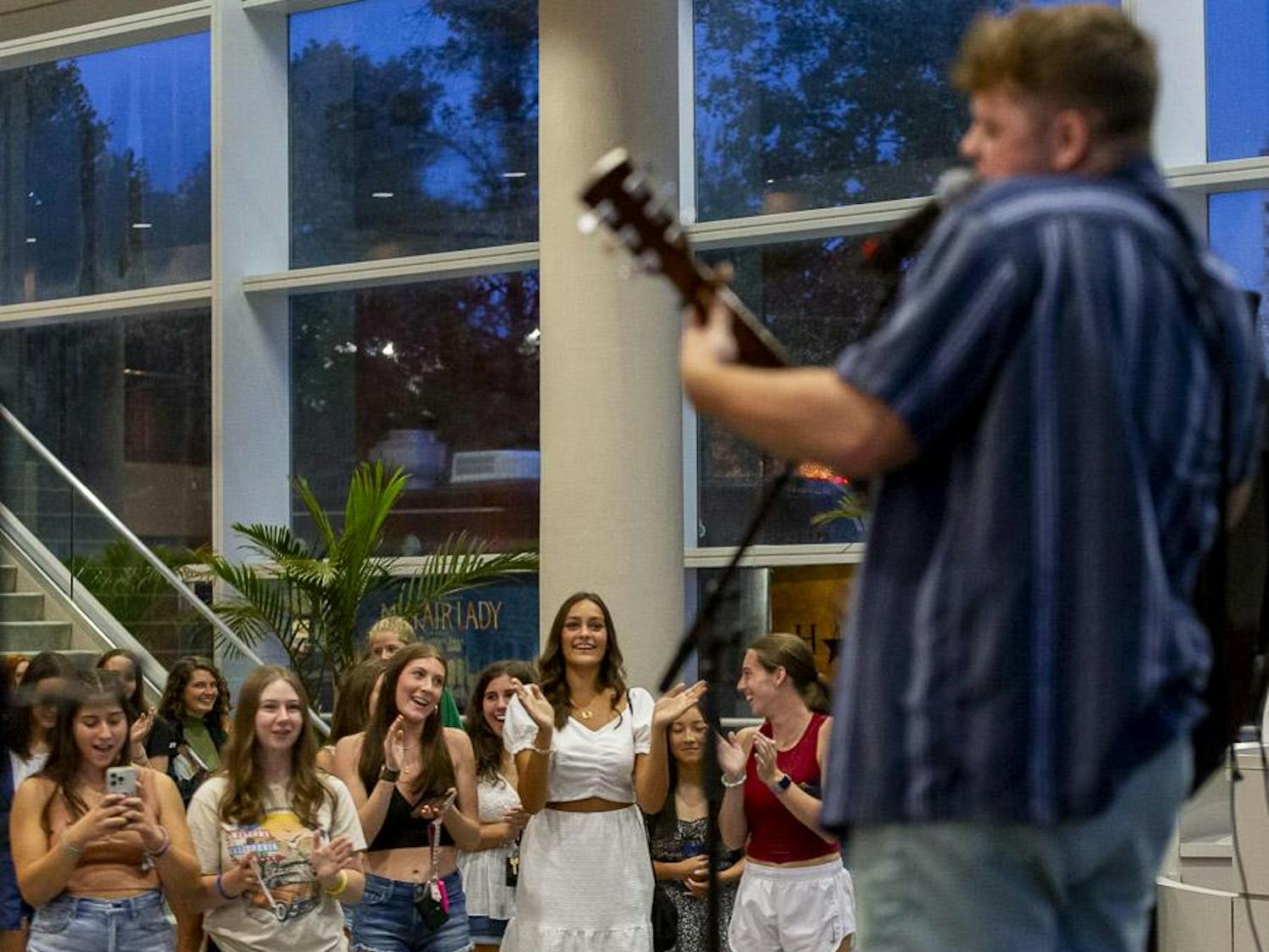 Students clap during Will Cullen's headlining performance at the Koger Center on Aug. 27, 2023. Cullen performed a mashup of popular songs and played some of his original tracks.