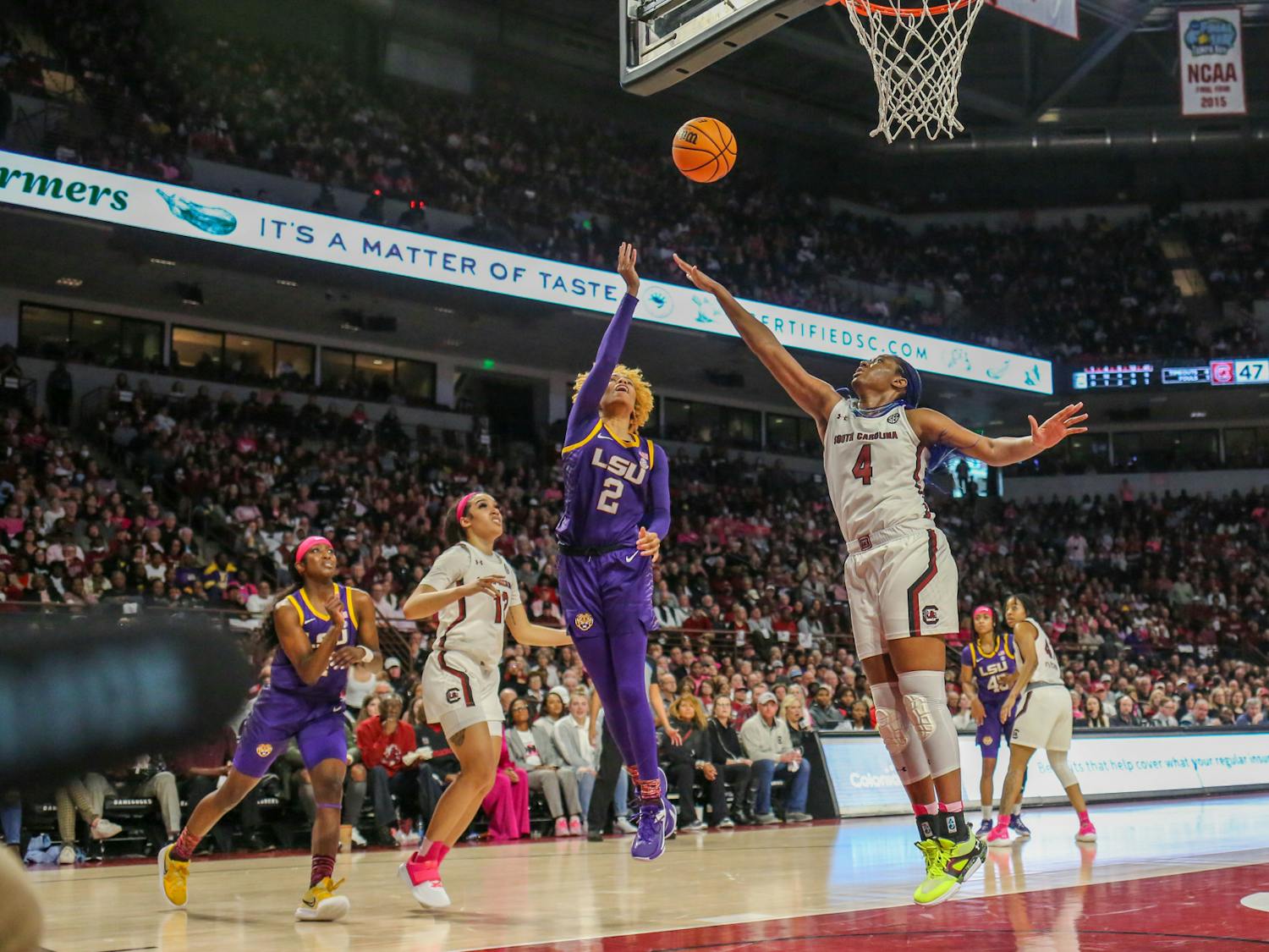 South Carolina's senior forward Aliyah Boston attempts to block a layup by LSU’s Jasmine Carson during the teams' matchup at Colonial Life Arena on Feb. 12, 2023. The Gamecocks beat the Tigers 88-64.
