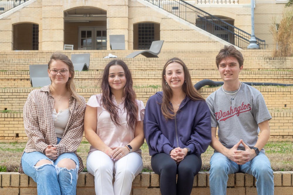 <p>From left to right, second-year environmental studies student Kayla Thompson, third-year international business, accounting and risk management and insurance student Bridget Salmon, second-year environmental studies student Mia LaPinta, and third-year environmental studies and political science student Jackson Hensley sit outside of Green Quad on Jan. 31, 2025. The four students host "Equalitree," a podcast focused on environmental justice.</p>