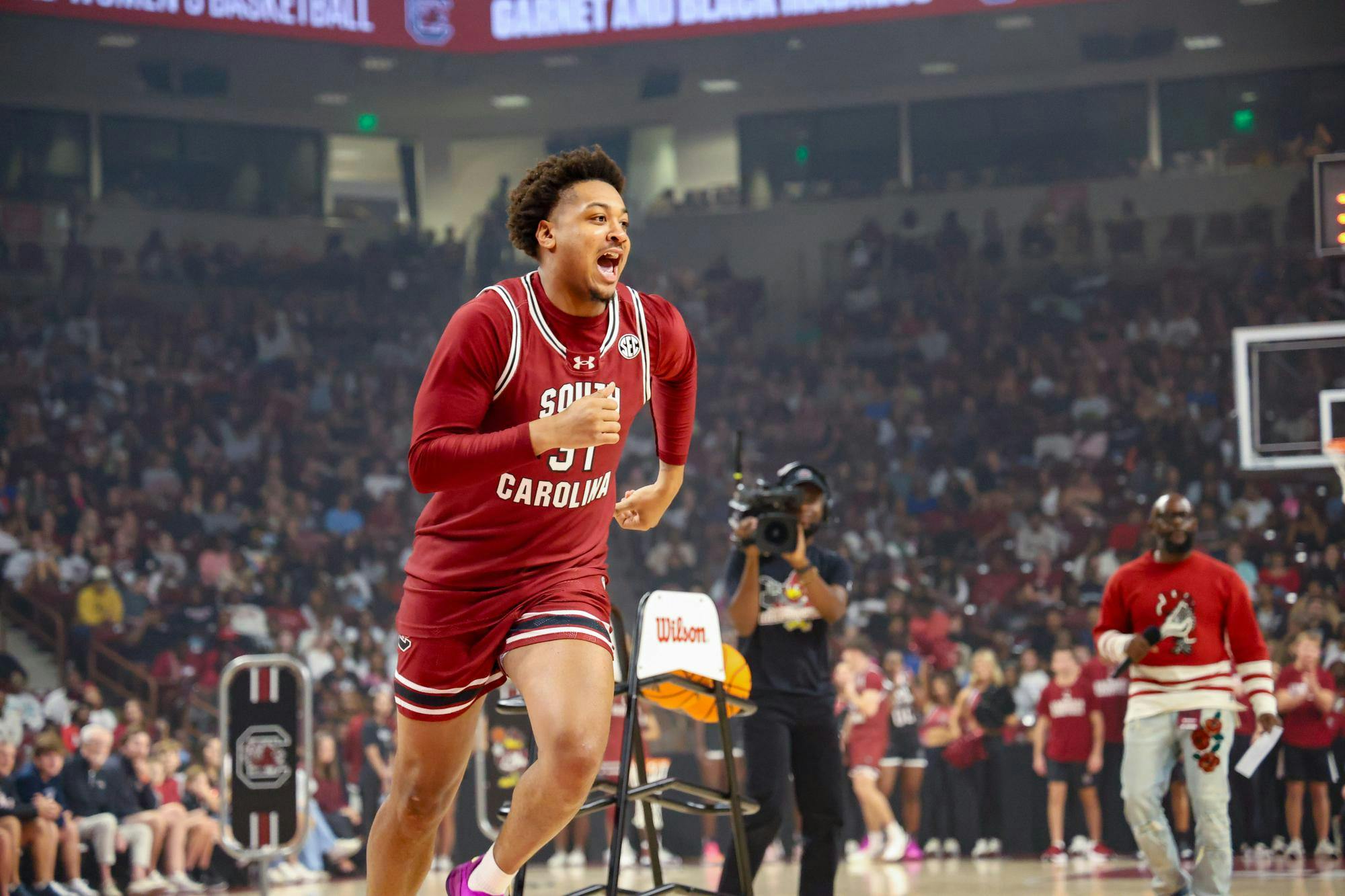 Junior forward Elijah Strong runs a challenge gauntlet at GarNET &amp; Black Madness on Oct. 21, 2025, at Colonial Life Arena. The gauntlet was a team effort between teams consisting of a member of both the men's and women's basketball team.