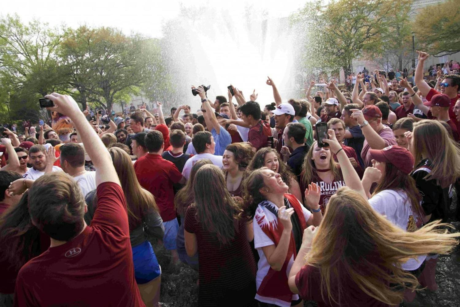 Students jump in the fountain to celebrate the Gamecocks men’s basketball team beating Florida in the Elite Eight and securing its place in the Final Four in 2017.