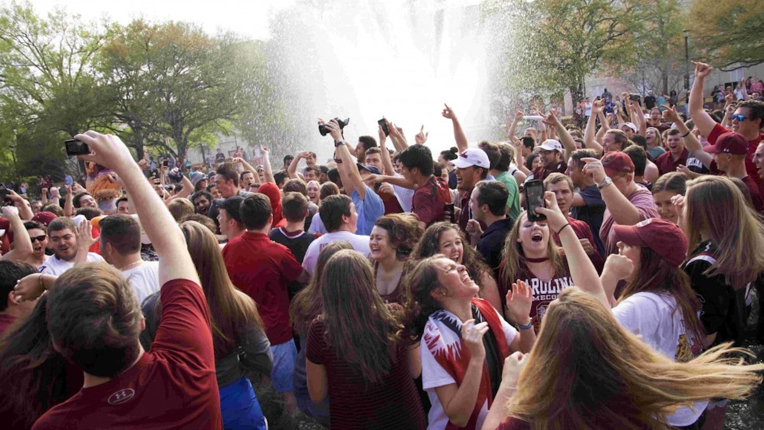 Students jump in the fountain to celebrate the Gamecocks men’s basketball team beating Florida in the Elite Eight and securing its place in the Final Four in 2017.