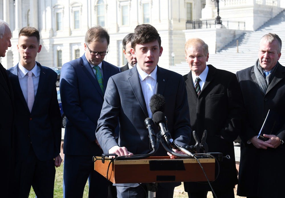 Kyle Kashuv, who survived the shooting at Stoneman Douglas last month, joins Florida Sens. Marco Rubio and Bill Nelson during a press conference to call for swift passage of a bill to address school violence Tuesday, March 13, 2018 on Capitol Hill in Washington, D.C. (Olivier Douliery/Abaca Press/TNS) 